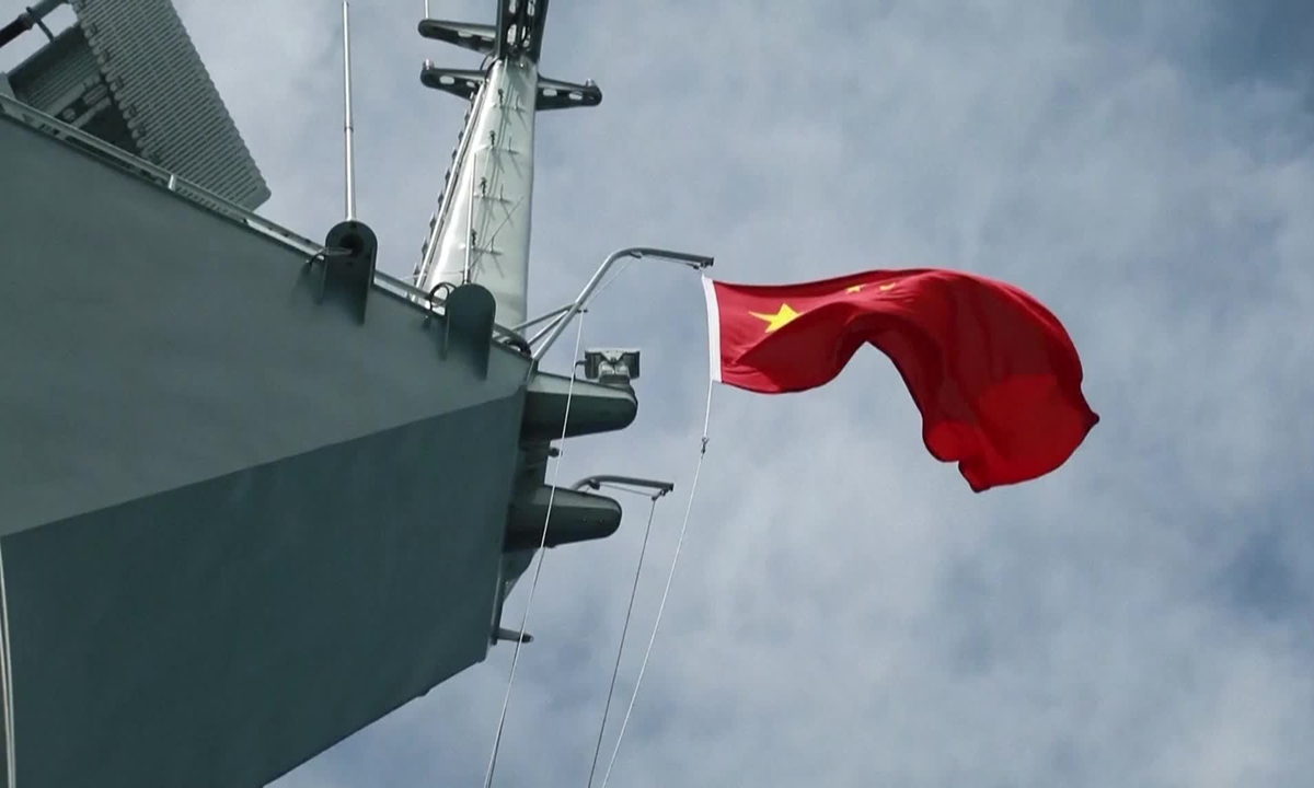 The Chinese national flag waves on a Chinese People's Liberation Army warship as it conducts joint military drills surrounding the island of Taiwan on May, 23 2024. Photo:IC